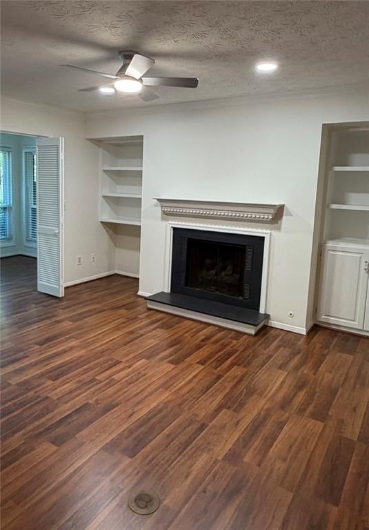 319 Park Ridge Circle Marietta, GA 30068 - Photo 12 of 32 an empty room with wooden floor fireplace and windows