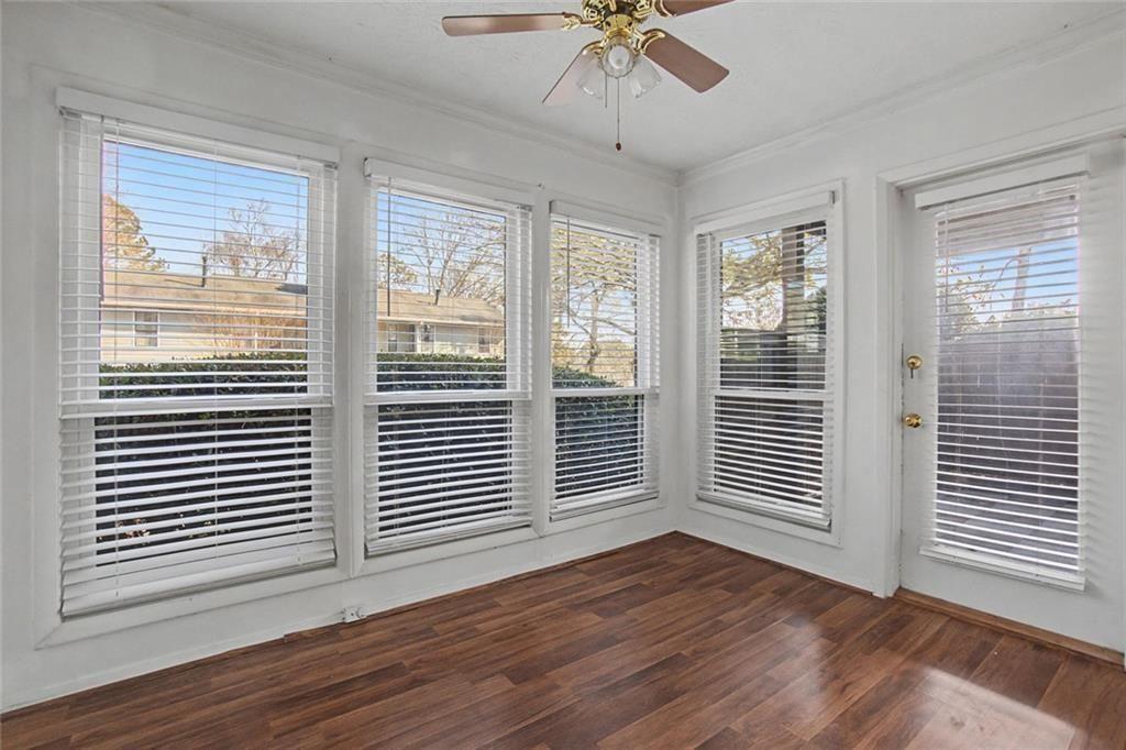 319 Park Ridge Circle Marietta, GA 30068 - Photo 17 of 32 a view of an empty room with wooden floor and a window