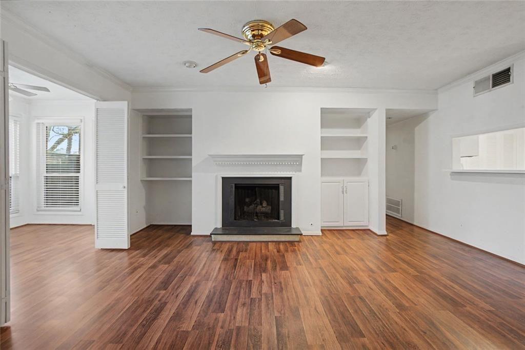 319 Park Ridge Circle Marietta, GA 30068 - Photo 19 of 32 wooden floor fireplace and natural light in room