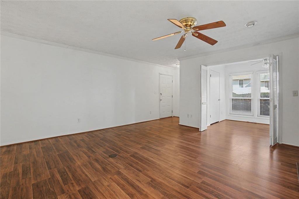 319 Park Ridge Circle Marietta, GA 30068 - Photo 21 of 32 a view of empty room with wooden floor and ceiling fan