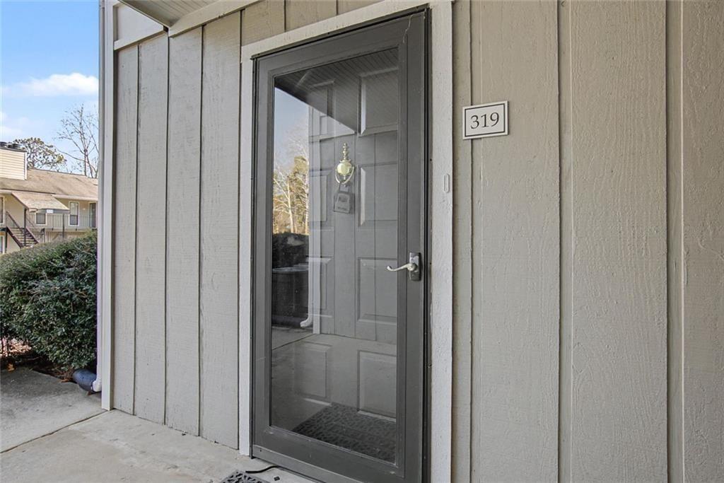 319 Park Ridge Circle Marietta, GA 30068 - Photo 3 of 32 a view of a bathroom from a hallway