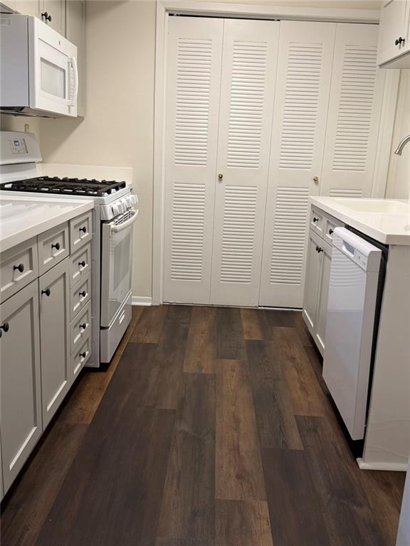319 Park Ridge Circle Marietta, GA 30068 - Photo 4 of 32 a kitchen with cabinets a stove and wooden floor