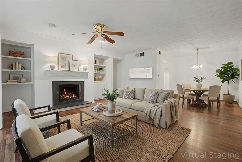 319 Park Ridge Circle Marietta, GA 30068 - Photo 5 of 32 a living room with furniture a rug and a fireplace