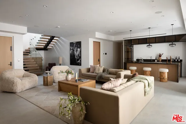 a bed room with large bed and a large window