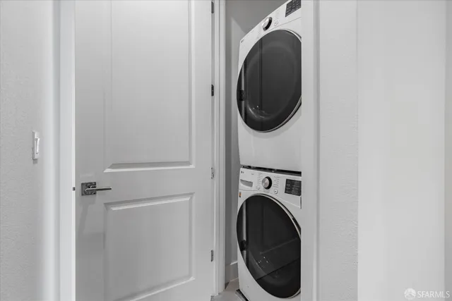 a close view of a utility room with dryer and washer