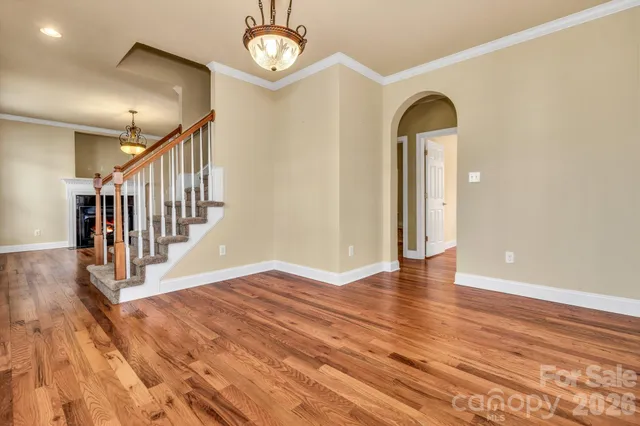 a view of an entryway with wooden floor