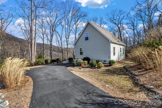 a view of backyard of house with outdoor seating