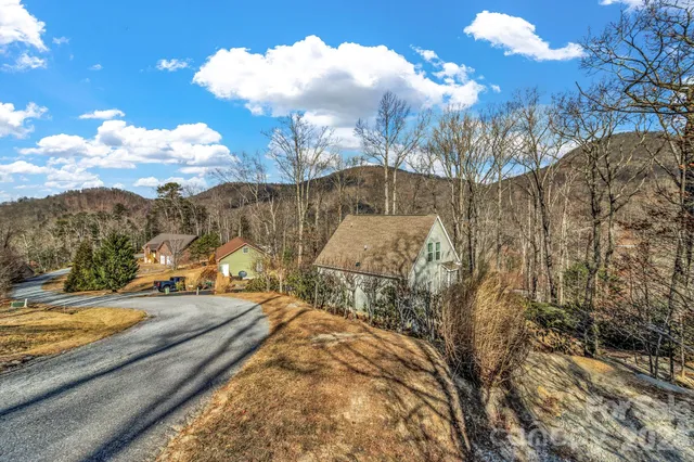 a view of a yard with swimming pool