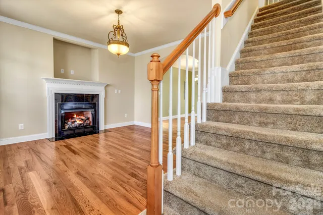 a view of an entryway with fireplace