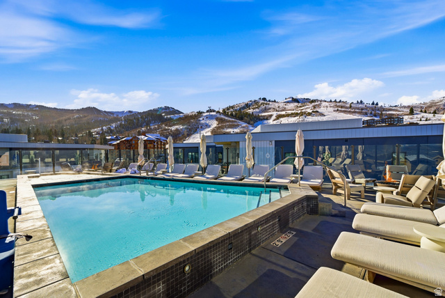 2417 West High Road, Unit 2515 Park City, UT 84098 - Photo 37 of 67 Community pool featuring a mountain view and a patio