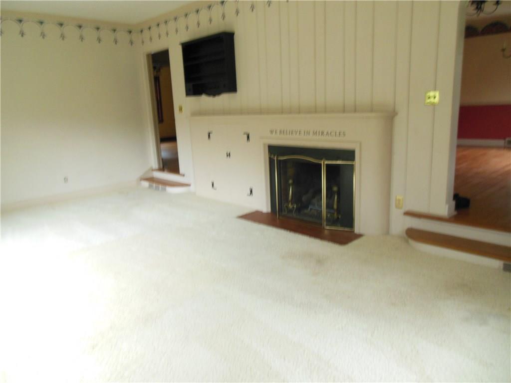 108 Ludwig Road New Castle, PA 16105 - Photo 8 of 20 Opposite view of sunken living room with fireplace