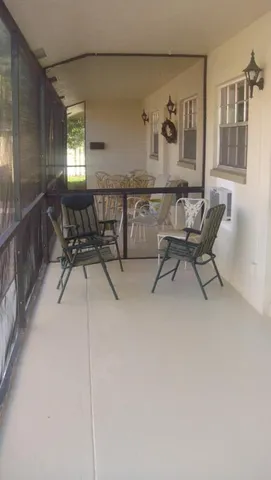 a view of a chairs and table in a room