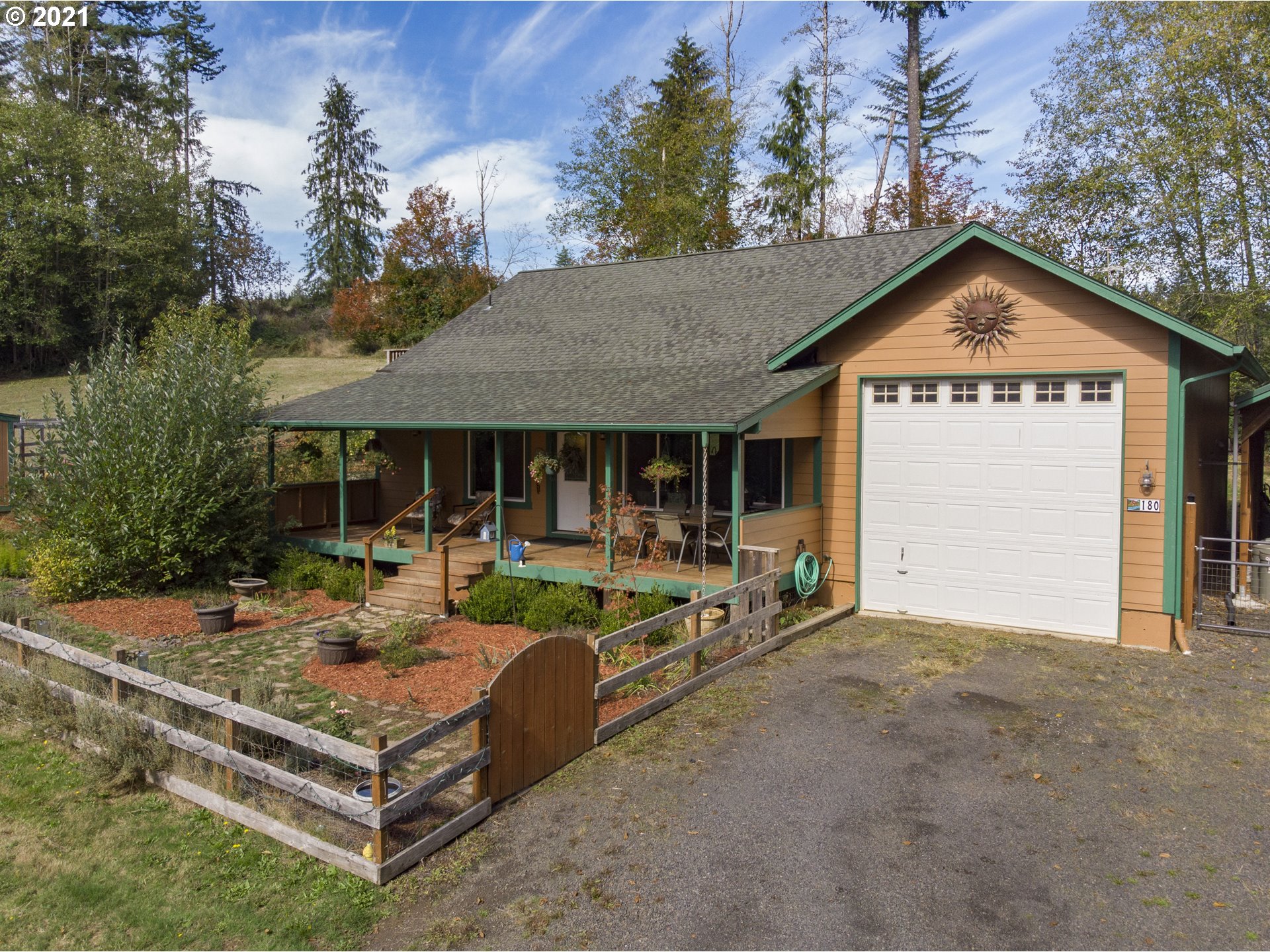180 Merganser Road Longview, WA 98632 - Photo 1 of 32 a view of a house with backyard and sitting area