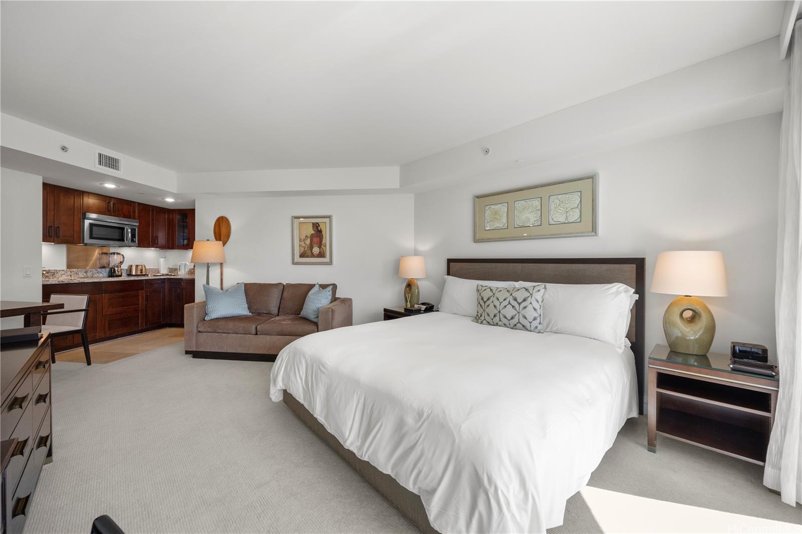 223 Saratoga Road, Unit 1114 Honolulu, HI 96815 - Photo 13 of 23 a bedroom with bed and a night stand