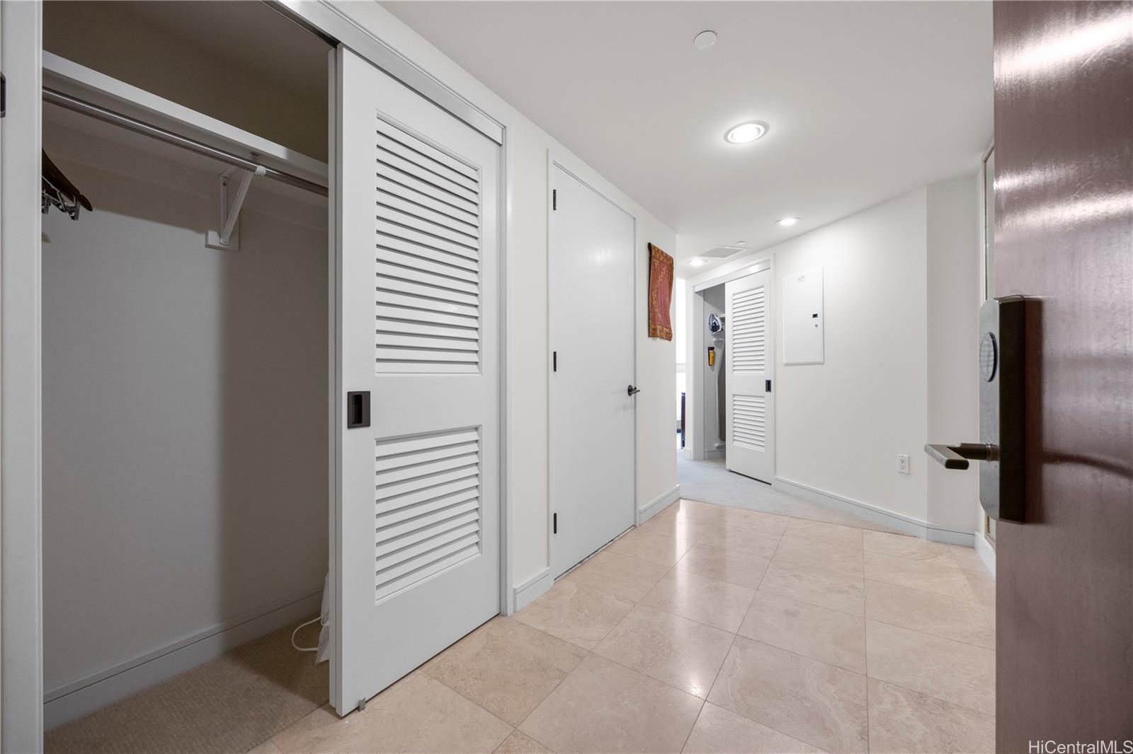 223 Saratoga Road, Unit 1114 Honolulu, HI 96815 - Photo 2 of 23 a view of a hallway with closet