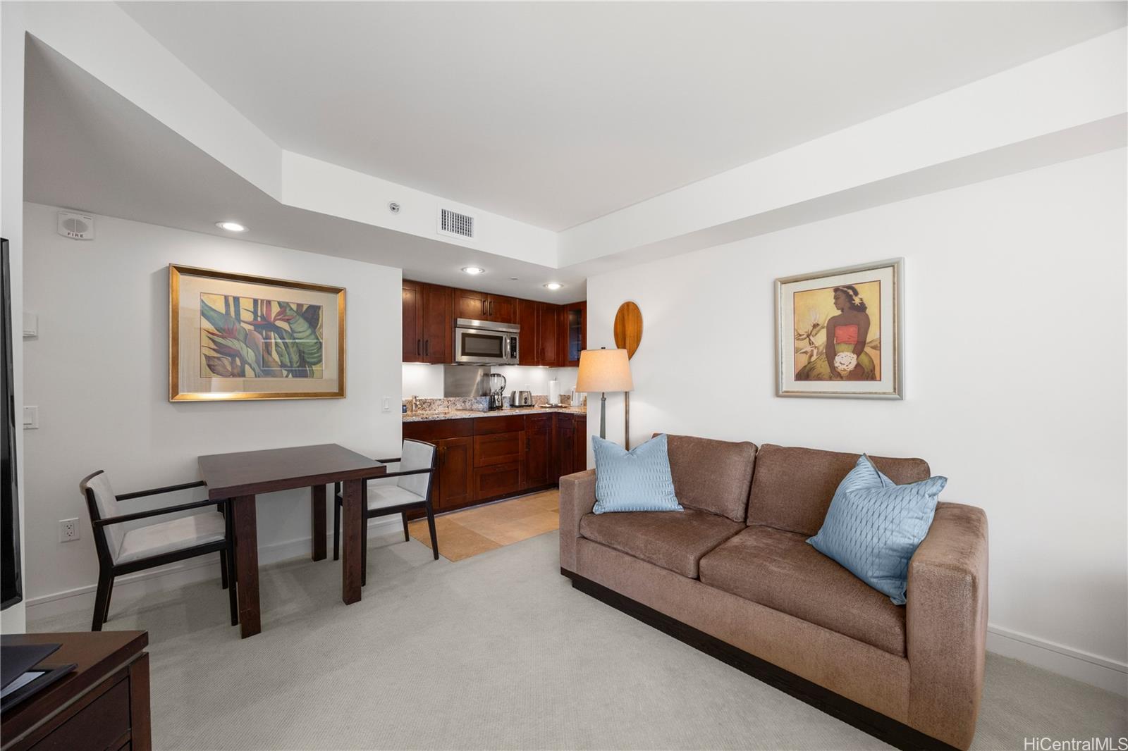 223 Saratoga Road, Unit 1114 Honolulu, HI 96815 - Photo 6 of 23 a living room with furniture a rug and a window
