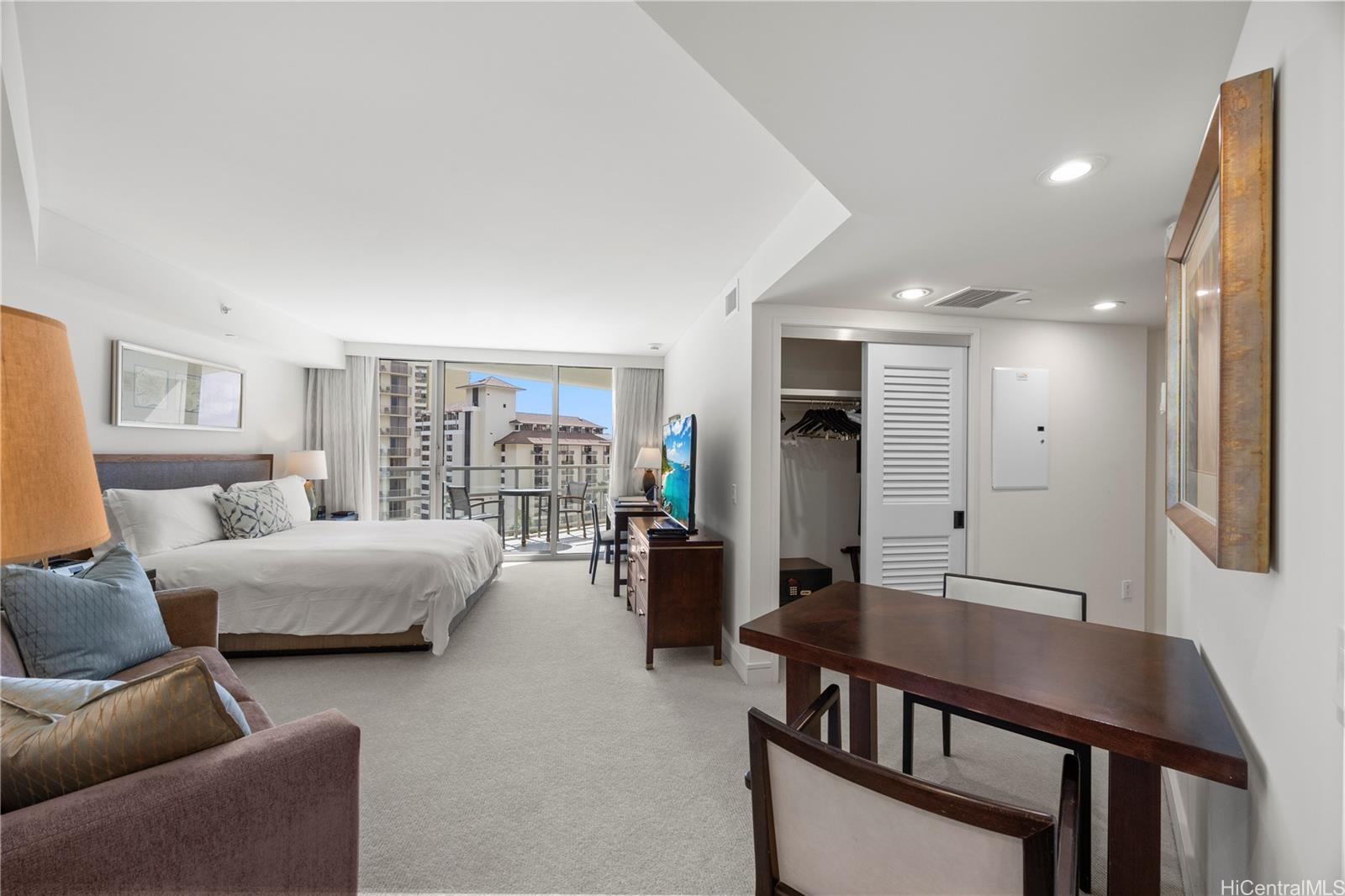 223 Saratoga Road, Unit 1114 Honolulu, HI 96815 - Photo 8 of 23 a living room with furniture and wooden floor