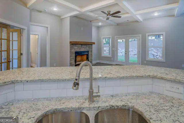 a kitchen with granite countertop a sink and a granite counter tops