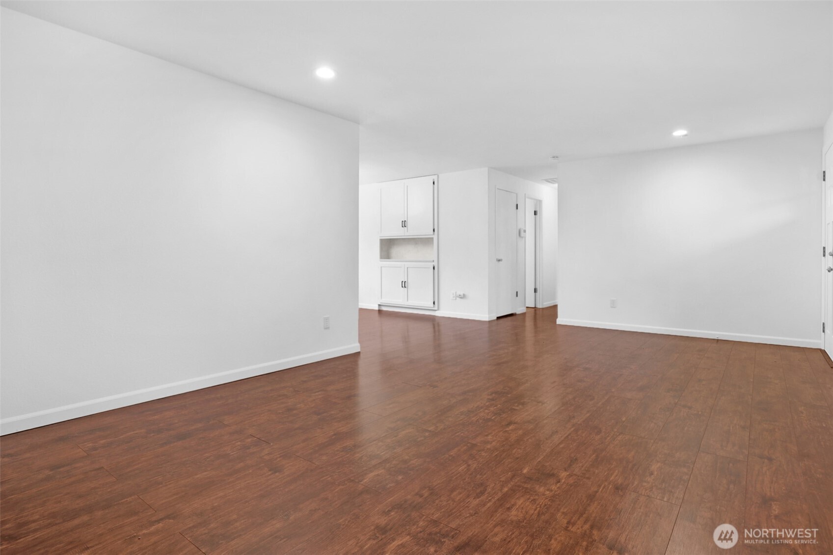 2105 100th Street Southeast Everett, WA 98208 - Photo 13 of 31 an empty room with wooden floor and windows