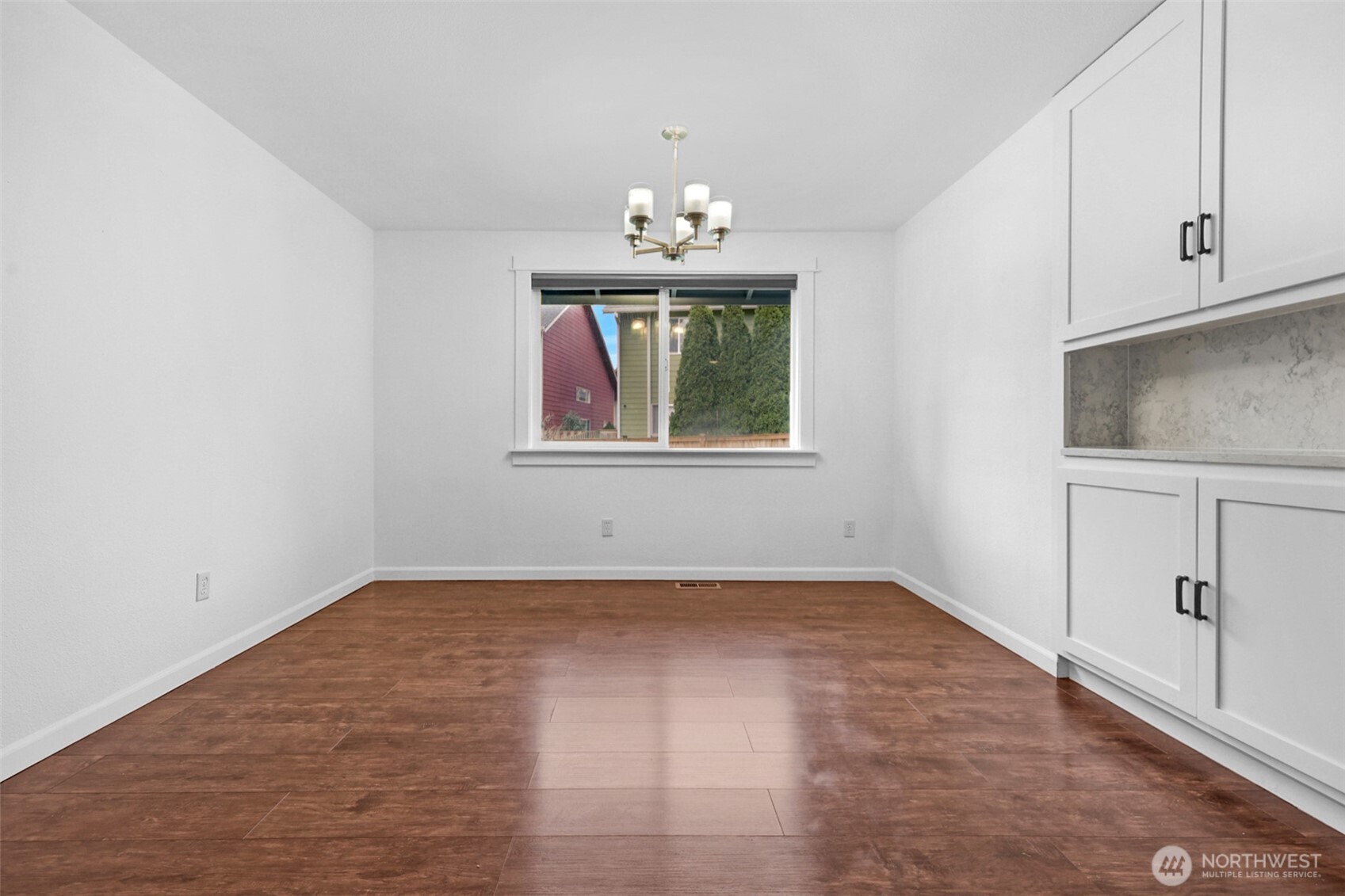 2105 100th Street Southeast Everett, WA 98208 - Photo 15 of 31 an empty room with chandelier fan and windows