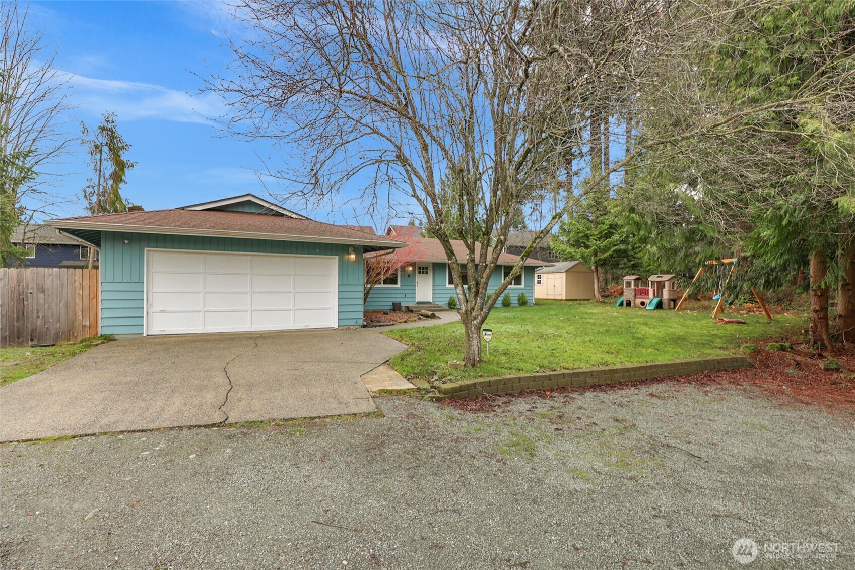 2105 100th Street Southeast Everett, WA 98208 - Photo 26 of 31 a view of a house with a yard and garage