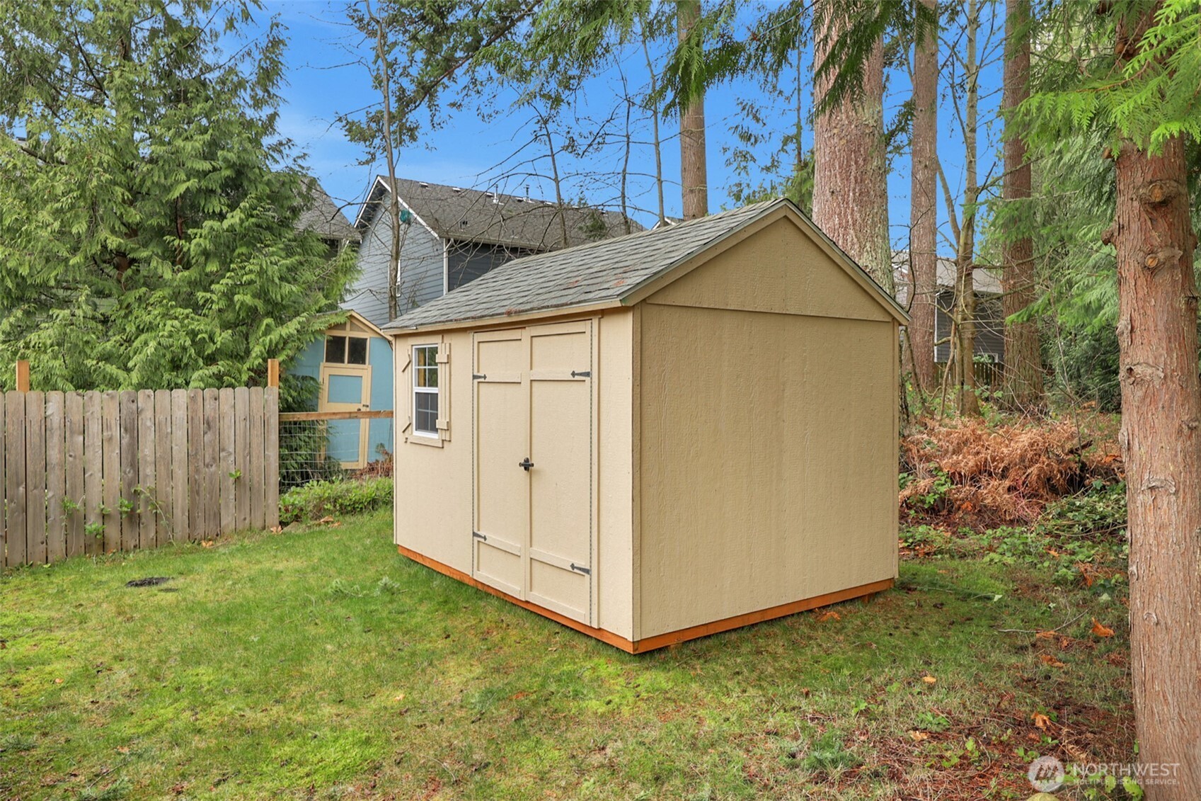 2105 100th Street Southeast Everett, WA 98208 - Photo 31 of 31 a view of backyard of house with wooden fence and large trees
