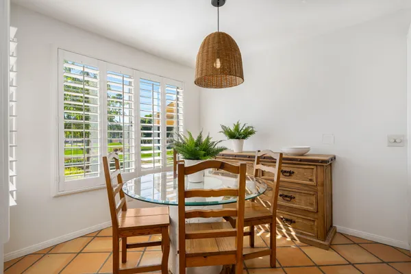 a view of a dining room with furniture and window