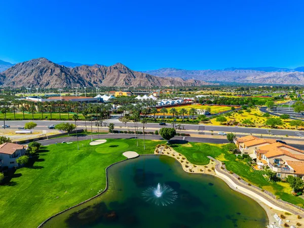 a view of a city with mountains in the background