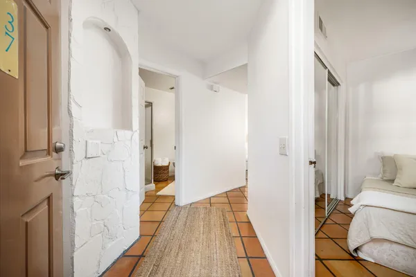 a view of a bedroom from a hallway