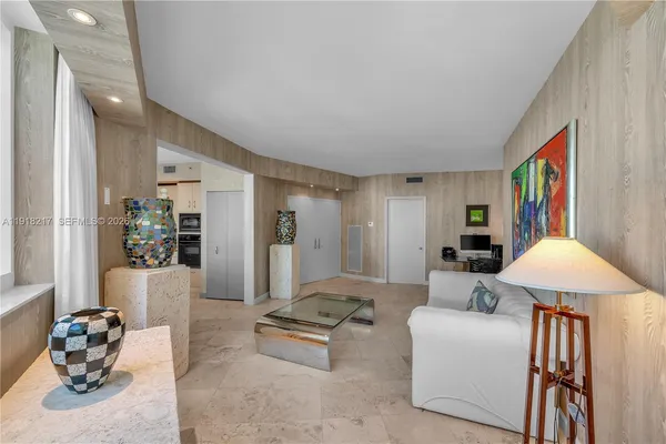 a living room with furniture and a table