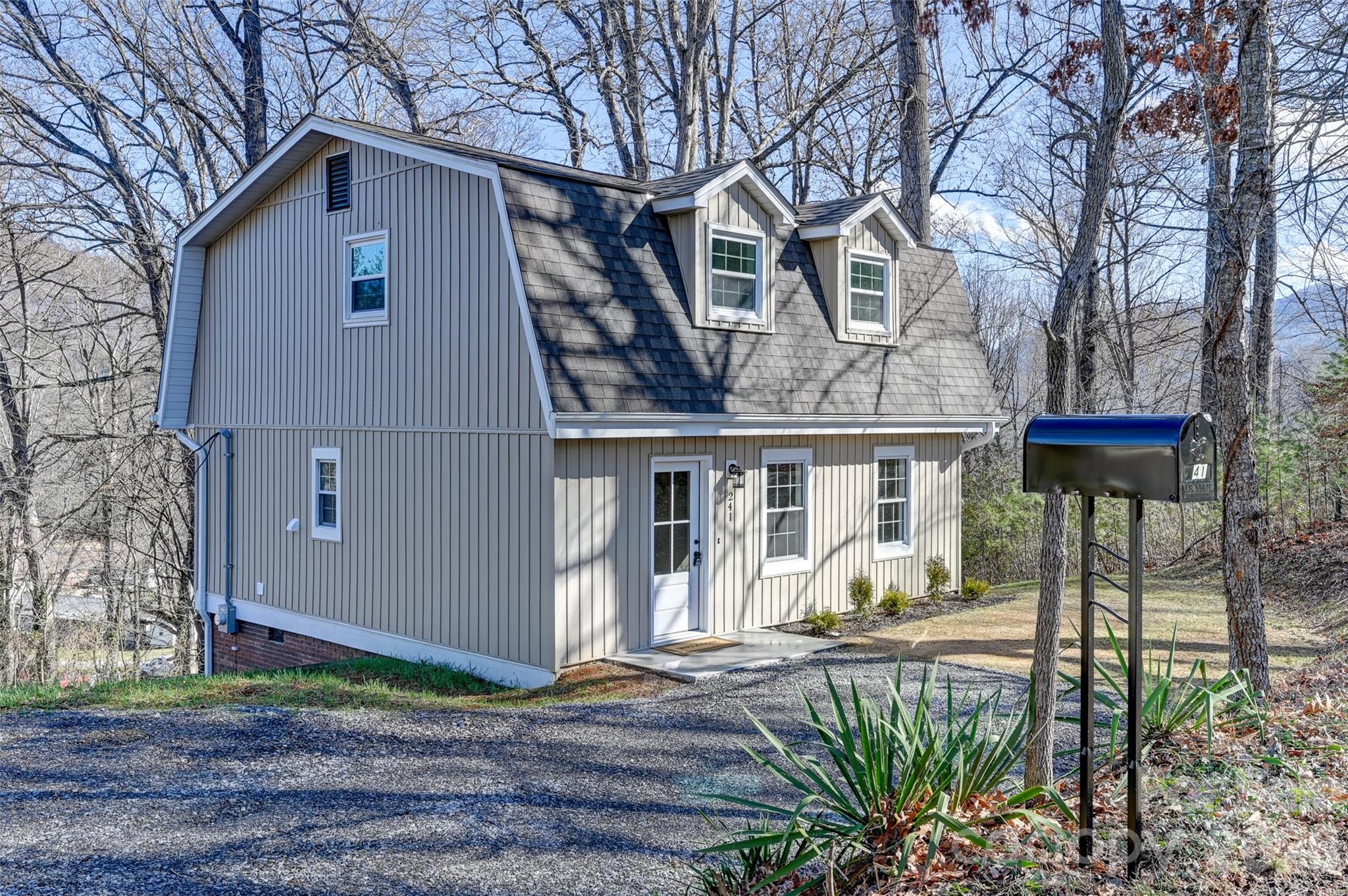 241 Sherrill Lane Canton, NC 28716 - Photo 13 of 39 a front view of a house with garden