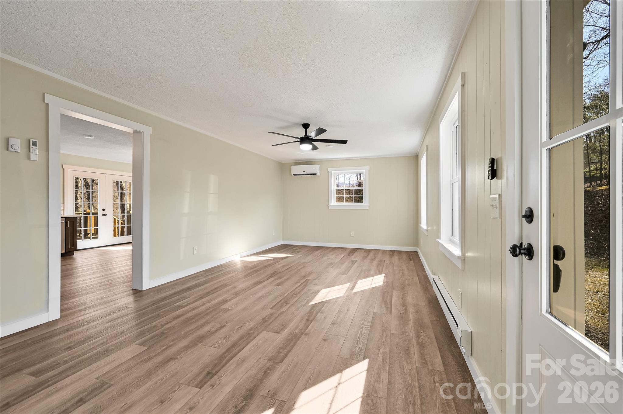 241 Sherrill Lane Canton, NC 28716 - Photo 15 of 39 wooden floor in an empty room with a window
