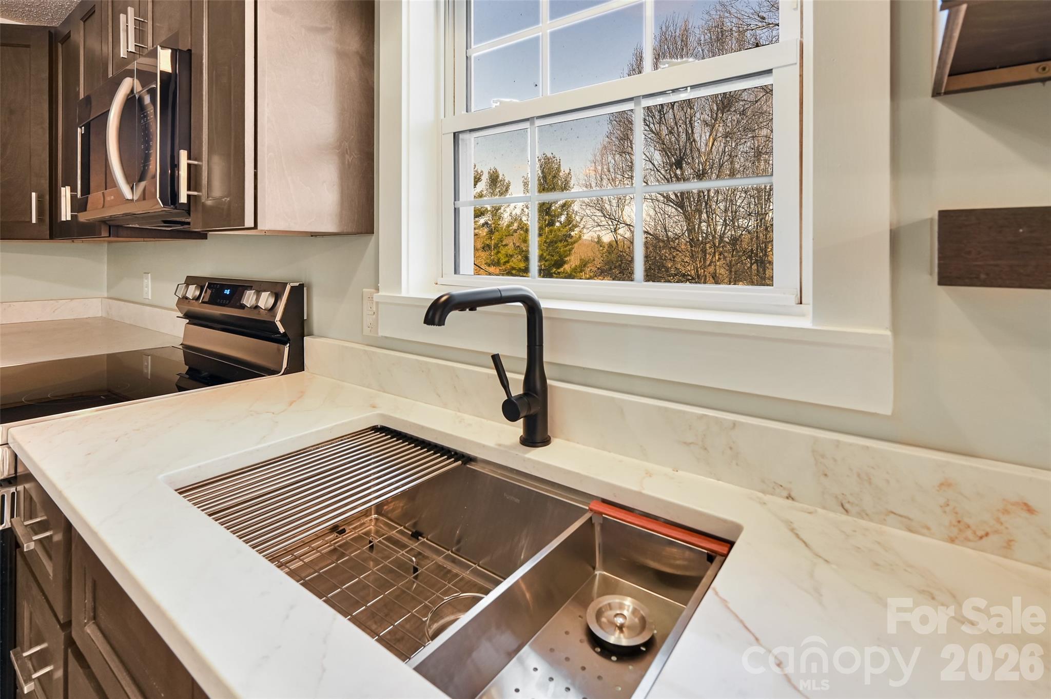 241 Sherrill Lane Canton, NC 28716 - Photo 20 of 39 a view of a sink and a microwave