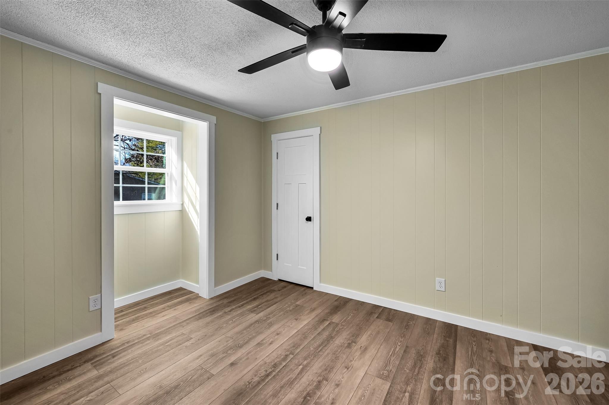 241 Sherrill Lane Canton, NC 28716 - Photo 38 of 39 an empty room with wooden floor closet and ceiling fan