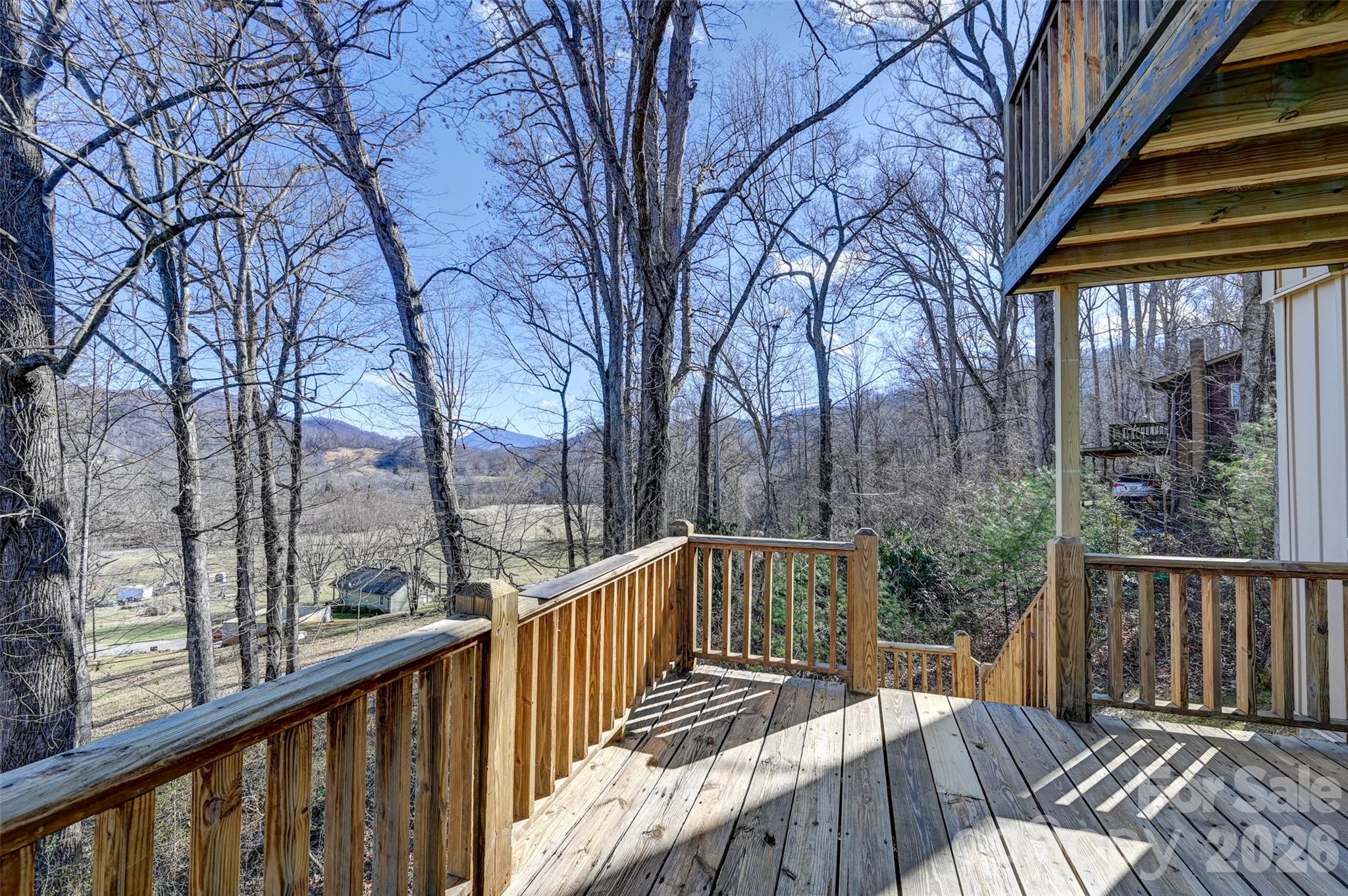 241 Sherrill Lane Canton, NC 28716 - Photo 4 of 39 a view of a wooden deck with trees in front of house
