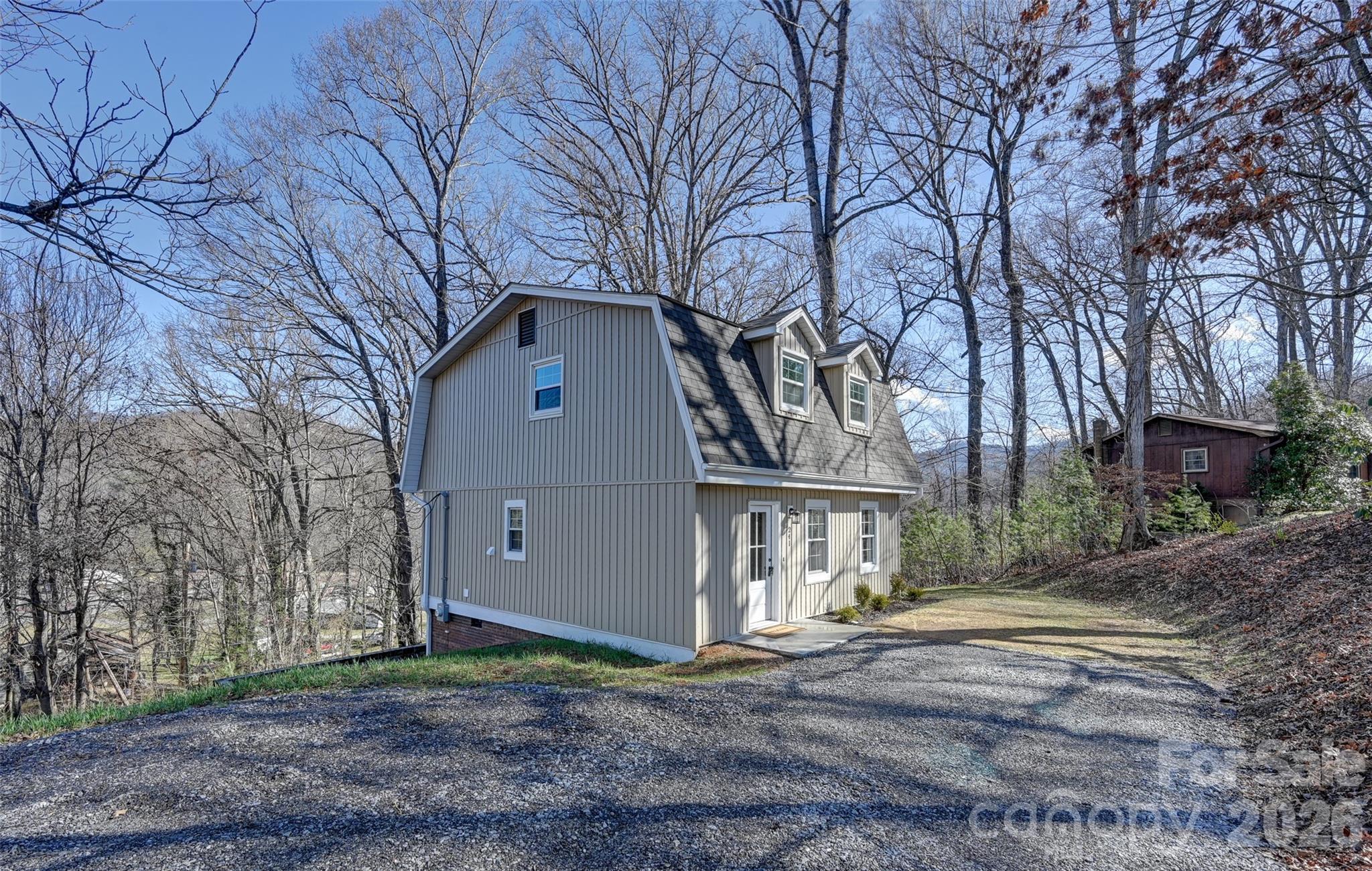 241 Sherrill Lane Canton, NC 28716 - Photo 8 of 39 a front view of a house with a yard and garage