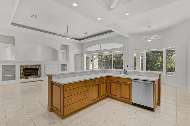 a kitchen with a stove sink and microwave