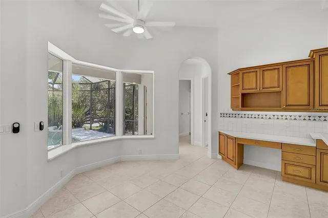 a view of a livingroom with furniture and windows