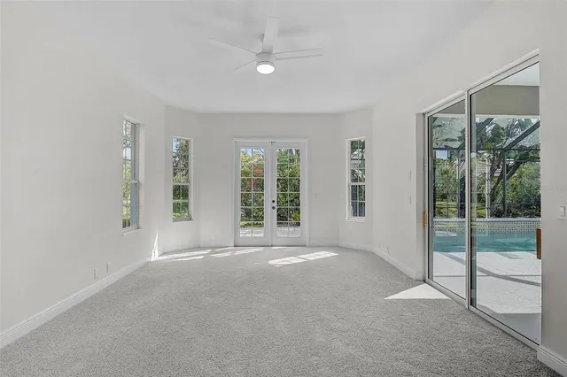 an empty room with windows and outdoor view