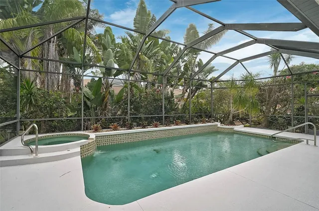 a view of a swimming pool with a yard