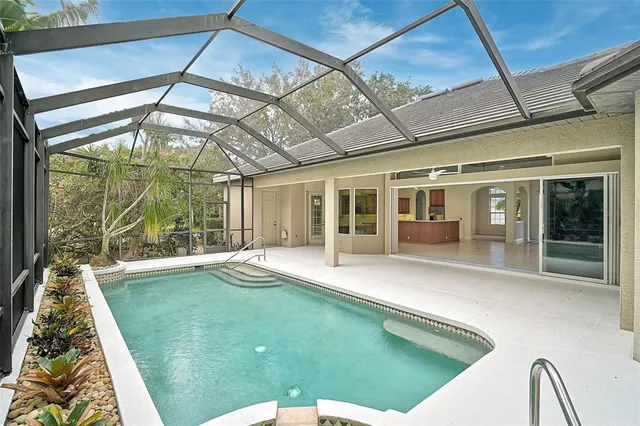 a swimming pool with a garden view