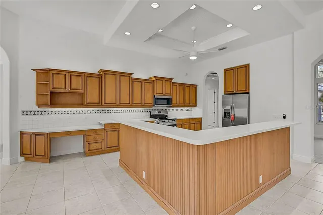 a kitchen with stainless steel appliances granite countertop a sink and cabinets