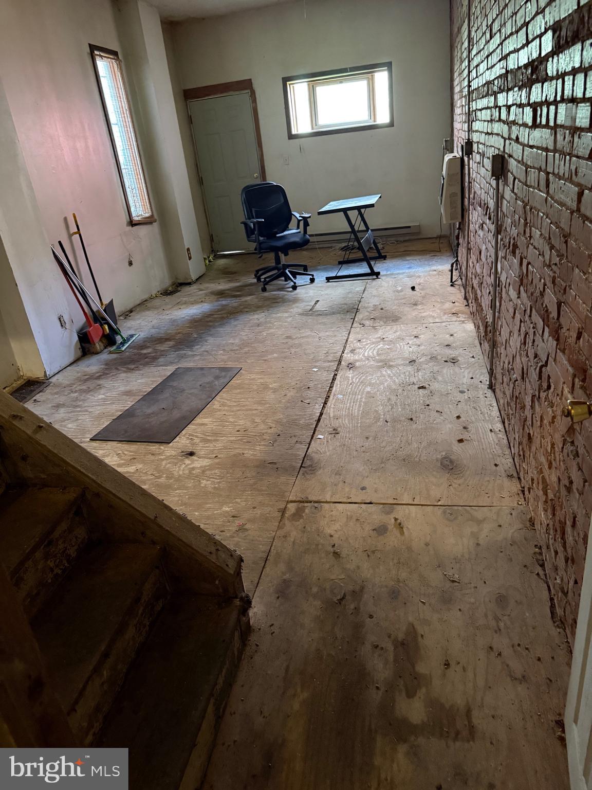 6013 Baltimore Avenue Philadelphia, PA 19143 - Photo 5 of 12 a view of a livingroom with wooden floor and a window