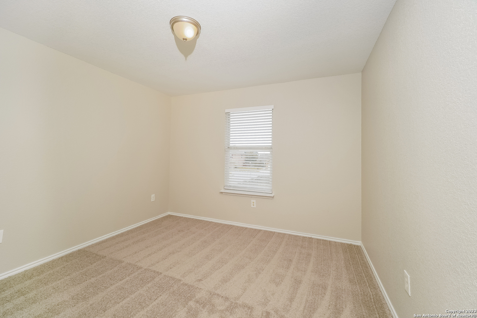 9620 Copper Sands Converse, TX 78109 - Photo 12 of 17 an empty room with a window