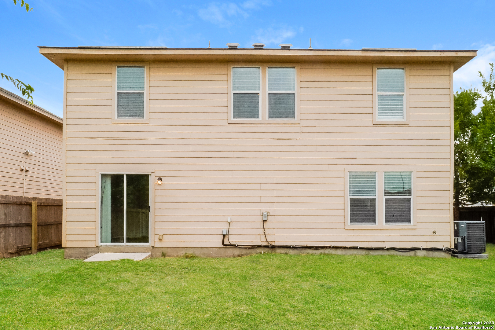 9620 Copper Sands Converse, TX 78109 - Photo 14 of 17 a front view of a house with a garden