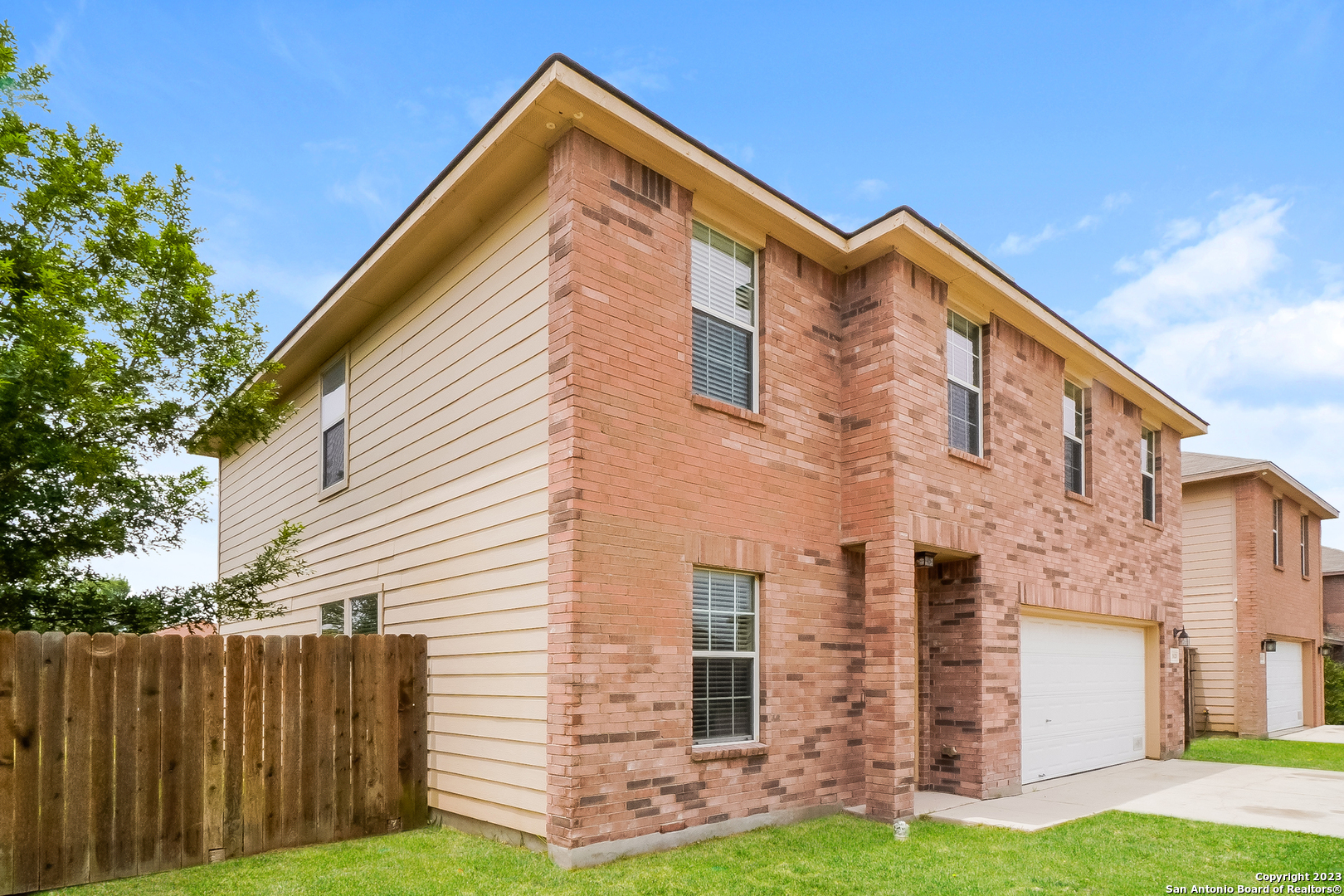 9620 Copper Sands Converse, TX 78109 - Photo 2 of 17 a front view of a house with a yard