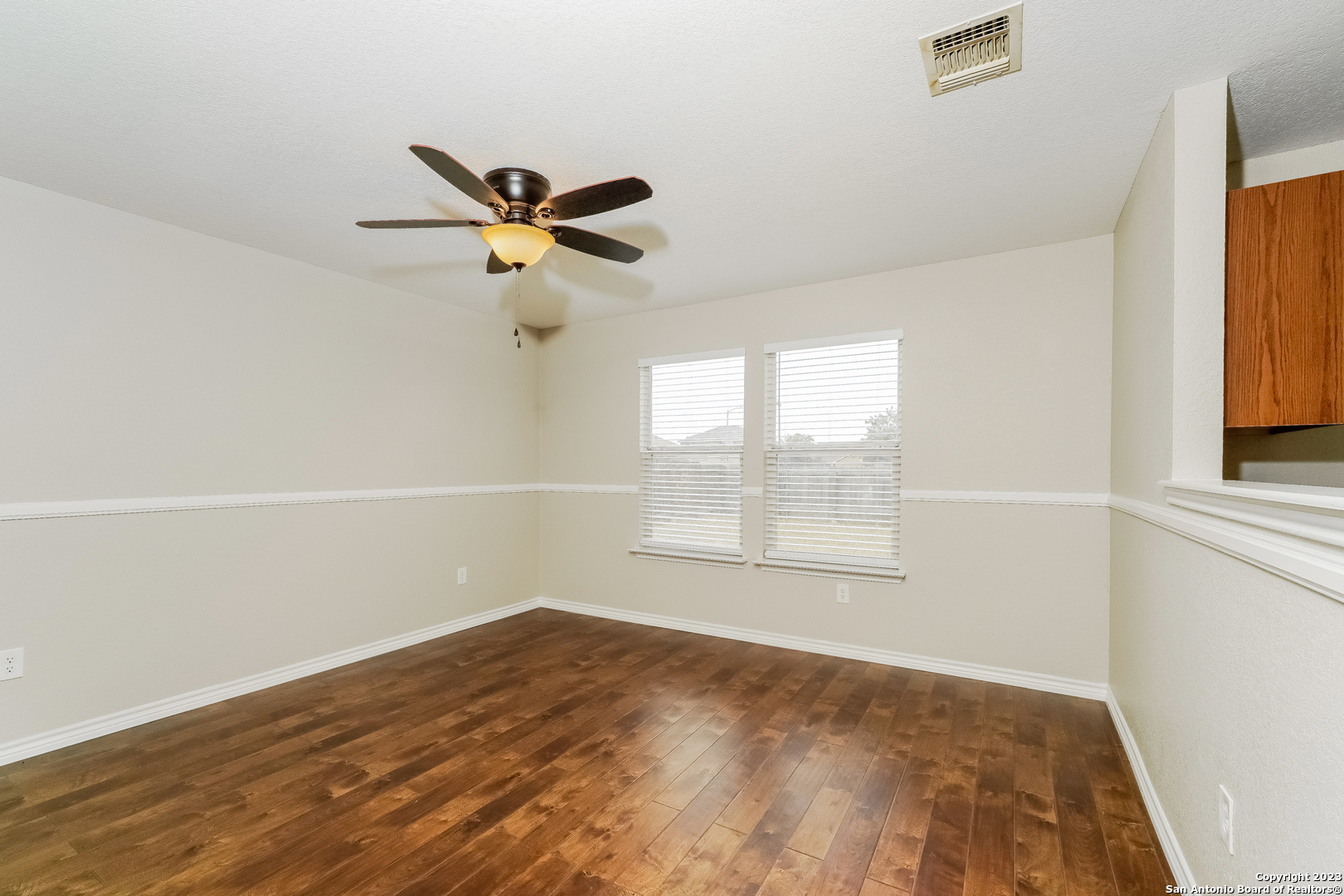 9620 Copper Sands Converse, TX 78109 - Photo 5 of 17 an empty room with a window and a ceiling fan