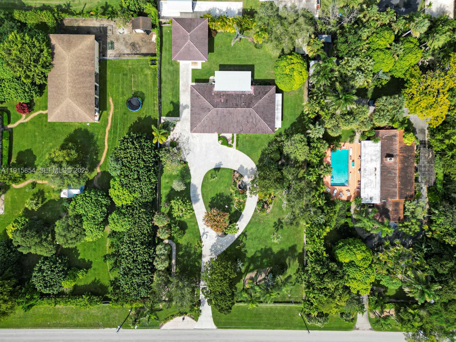 19425 Southwest 312th Street Homestead, FL 33030 - Photo 3 of 60 an aerial view of a house with garden space and street view