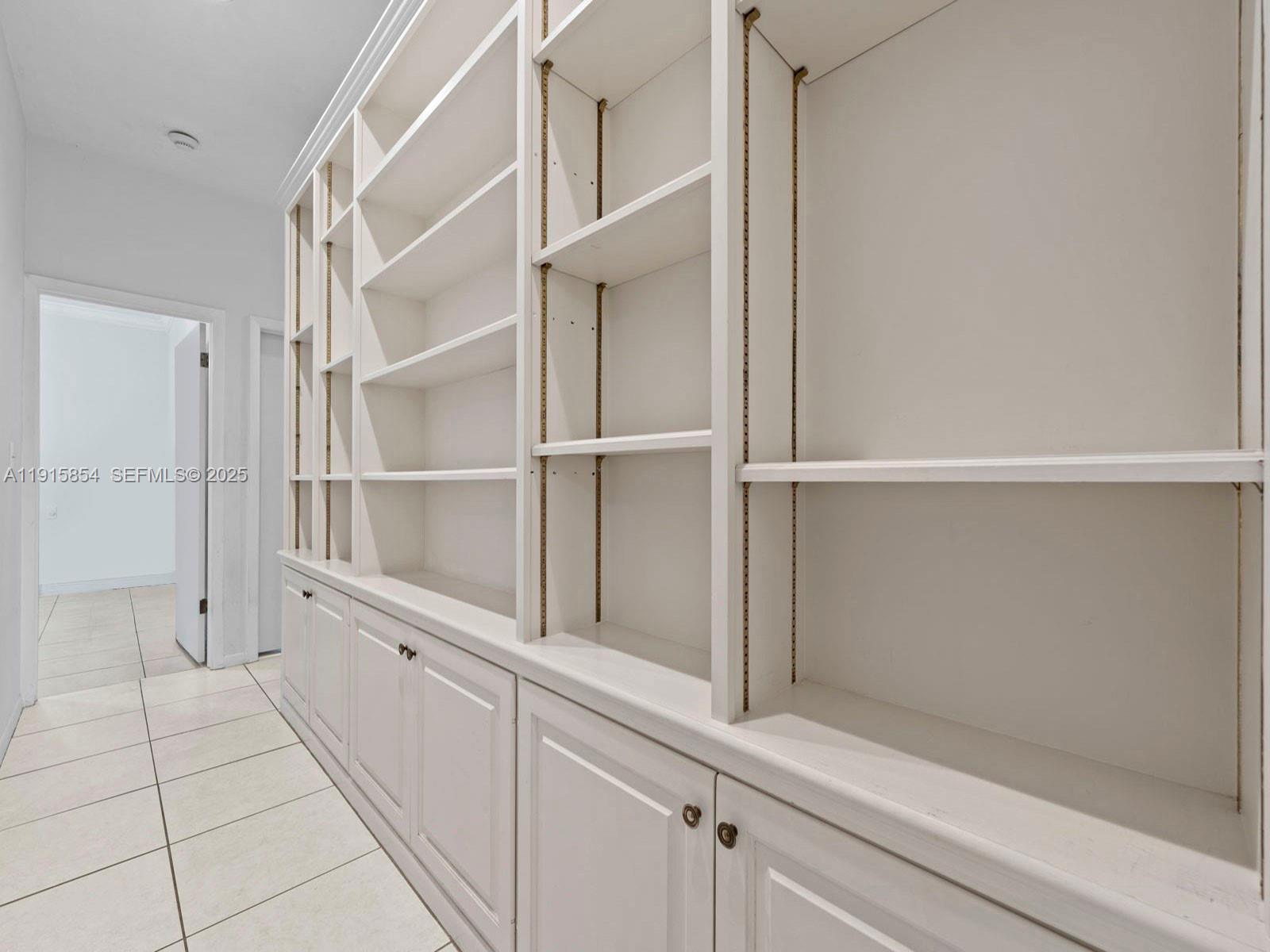 19425 Southwest 312th Street Homestead, FL 33030 - Photo 50 of 60 a hallway with closet
