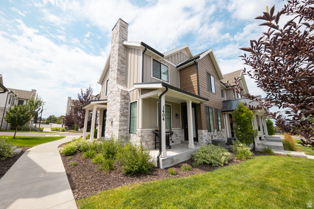 1404 East Rustic Wood Court Sandy, UT 84092 - Photo 2 of 33 Modern townhome exterior featuring a stone and siding facade